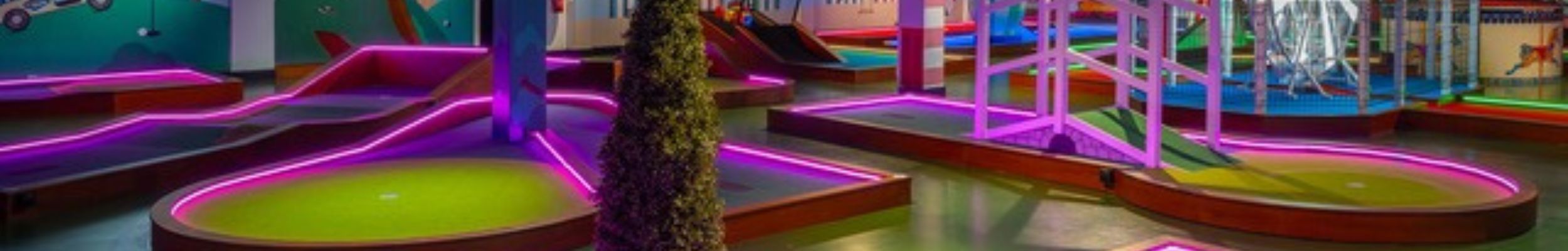 Neon LED strip lights lighting up Putt Hutt crazy golf course, Clarence Pier, Southsea